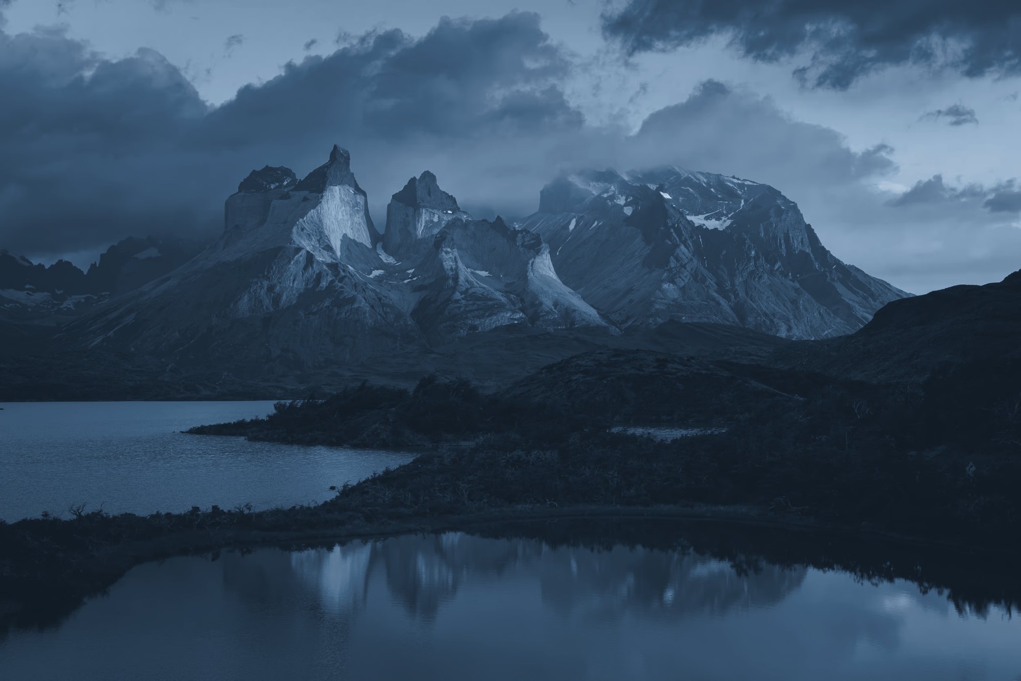 The granite horns of Torres del Paine above a still lake